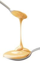 Custard or condensed milk dripping from spoon on white background 