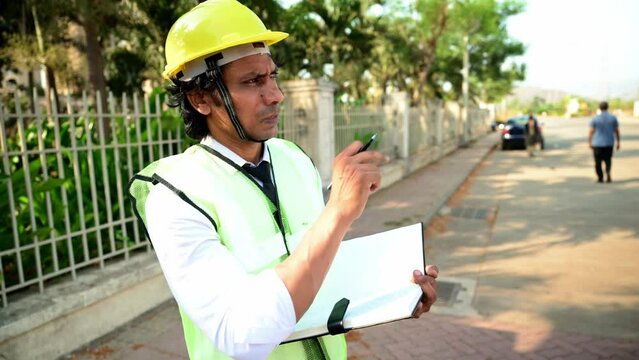 Construction worker taking notes