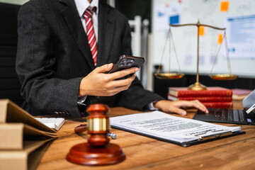 A young businesswoman is working at her desk, diligently preparing legal briefs and reviewing evidence for an upcoming trial, demonstrating her expertise as a lawyer in litigation and advocacy.