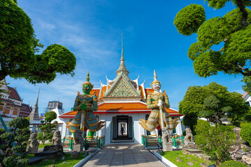 Obraz premium Pathway road to Ordination Hall with statues of Giants, demon guardians at Wat Arun