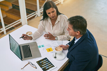 People, documents and business meeting with laptop at desk for financial report, budget or feedback. Top view, employees and tech with paperwork in office for investment, solution or review of growth