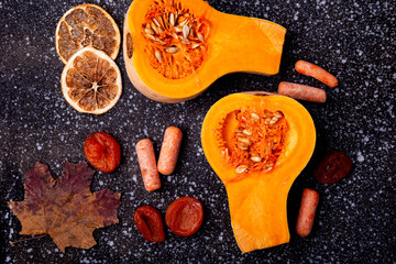 Fresh Autumn products - pumpkin and raw vegetables for Healthy Diet. Orange background