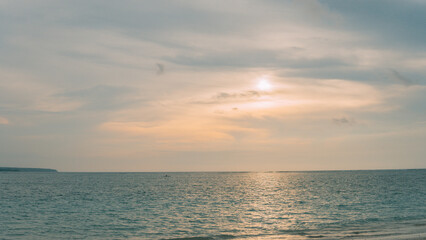 The view of the sunset and many beautiful clouds at Kelan Beach.
