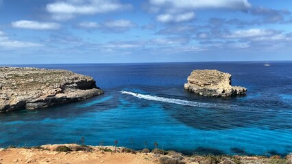 Comino Island Malta, Water scooters in between to rocks. Visiting caves in Comino . High quality photo