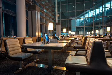 airport waiting room with digital tablets and lounge, advanced business class departures gate with...