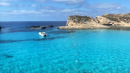 Comino Island Malta, Boat rides and visits to Comino Caves. Blue mediterranean sea. High quality photo