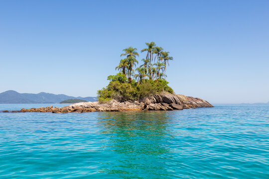 Stunning view of the Botinas Islands on a sunny day, with turquoise sea and blue sky. A true tropical paradise in Angra dos Reis, RJ, Brazil.