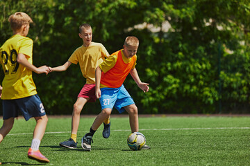 Energetic Team Play. Young athletes in uniform training, playing with focus and determination on...