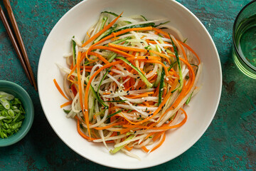 fresh and healthy cucumber, carrot and daikon radish salad