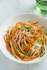 fresh and healthy cucumber, carrot and daikon radish salad