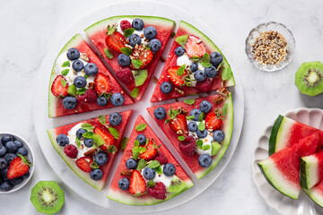 watermelon pizza with yogurt and fresh berries,