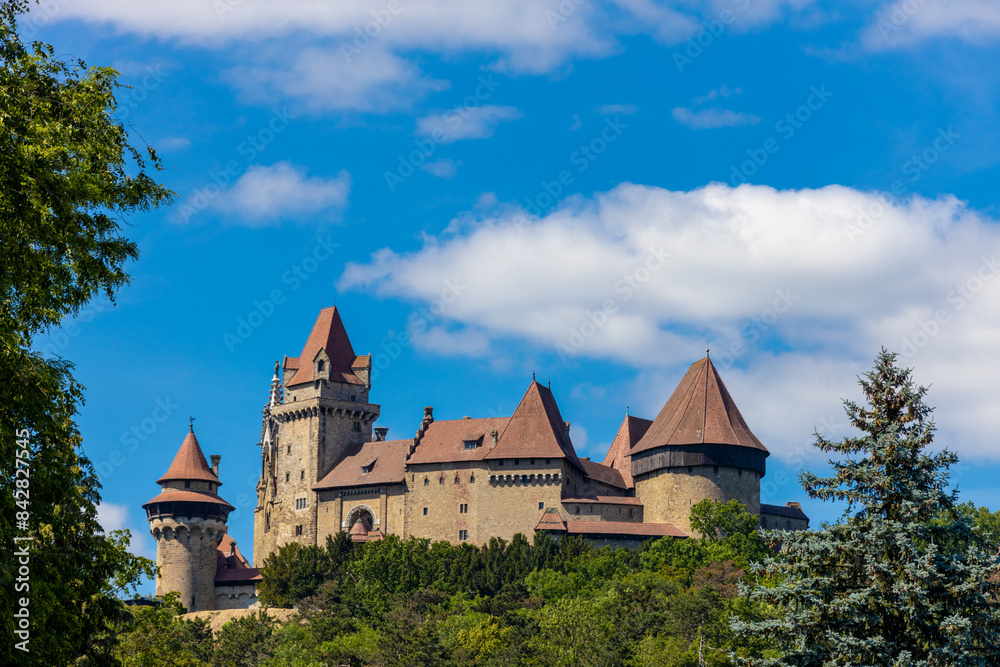 Wall mural castle landmark under blue sky. medieval castle in austria. ancient historical sights around vienna.