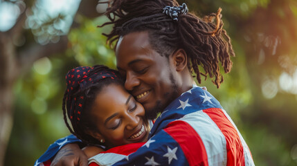 Independence Day. Happy couple wrapped in American flag smiling and hugging each other