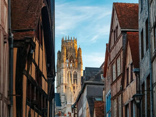 Fototapeta premium Street with half-timbered houses in Rouen with a view of the church