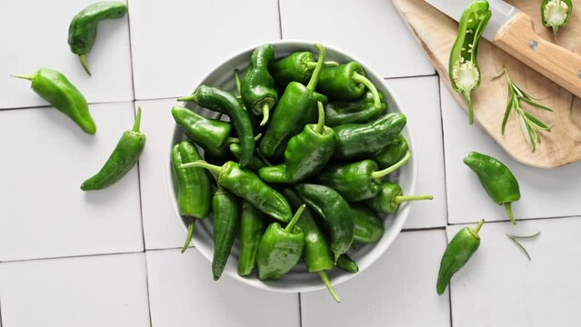 Fresh green Spanish Pimientos de Padron pepper or jalapeno, green bell pepper, stock video footage 4k