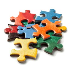 Fototapeta premium Critical Connections: Colorful Puzzle Pieces on White Background