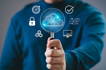 man holding magnifying glass with cloud computing diagram. Cloud technology. Data storage. Networking and internet service concept. Cloud digital data search system