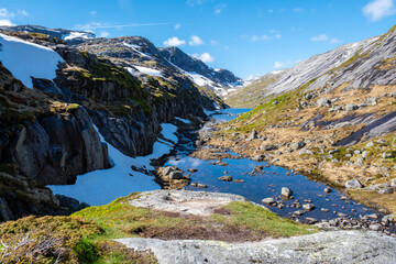 A breathtaking view of a tranquil mountain lake in Norway, showcasing the stunning beauty of the...