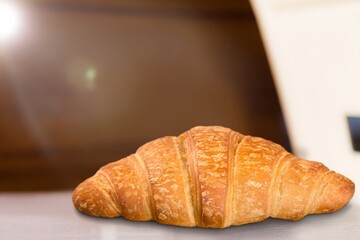 Single plain tasty croissant baked pastry