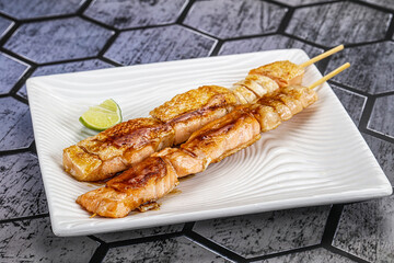 Grilled salmon skewer with sauce