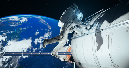 Portrait of a Handsome Young Astronaut Investigating a Satellite in Outer Space. Trained Professional in a Space Suit Performing Extravehicular Activity Outside the Spacecraft © Gorodenkoff