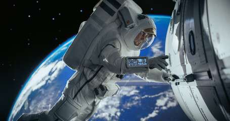 Astronaut on an Extravehicular Mission in Outer Space. Courageous Man Holding by the Handle,...