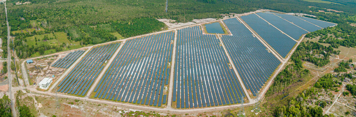 Panoramic aerial drone view of solar panels farm scenery at Pantai Jambu Bongkok, Marang, Terengganu, Malaysia.