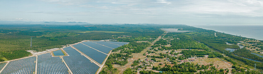 Aerial drone view of solar panels farm scenery at Pantai Jambu Bongkok, Marang, Terengganu, Malaysia.