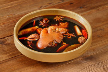 Wooden background board casserole braised pig's trotter