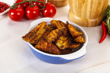 Golden baked potato Idaho with spices