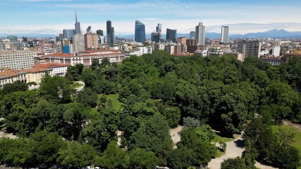 Italy, Milan , drone aerial view of Villa Reale and the new skyline with modern skyscrapers in downtown of the fashion city in Giardini di Porta Venezia Montanelli park . Milan Green city 