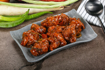 Manchurian chicken with sauce and spices