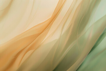 Flowing fabric in peach and green creating an abstract background with lines and curves, showcasing...