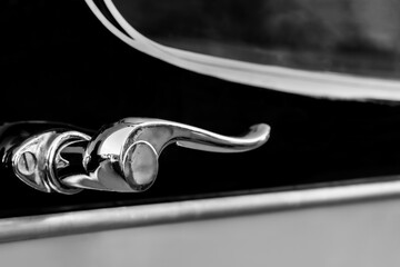 Close up of a vintage car door handle
