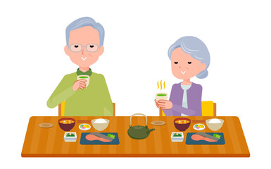 食事中に温かい青汁お茶を飲むシニア夫婦