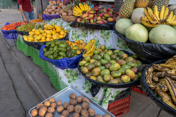 Stand with many different tropical fruits and vegetables on the street of a small tourist town in El Salvador, Ruta de las Flores.
