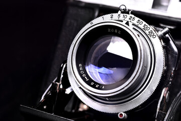 Closeup shot of vintage rangefinder  camera with its lens and adjustment ring of Speed shutter.