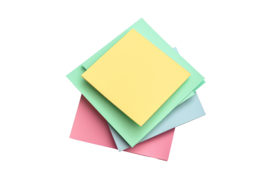 Colorful sticky notes in a variety of shades stacked together on a plain background, perfect for office or school use.