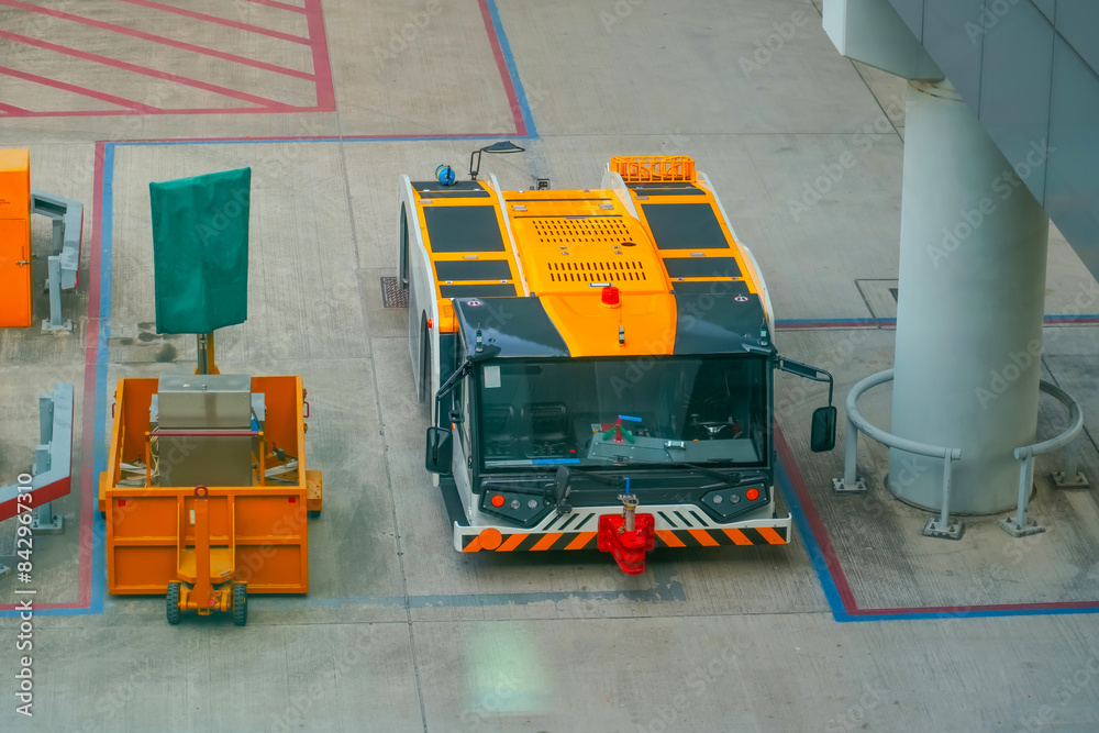 Wall mural Tug tow truck tractor parking lot on the airport tarmac