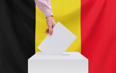 Elections, Belgium. Election concept. The voter throws the ballot into the box. Copy space