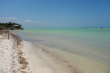 Crystal clear and shallow waters at Holbox island beach, Quintana Roo, Mexico