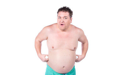 Fototapeta premium Funny fat man posing with milk. White background.