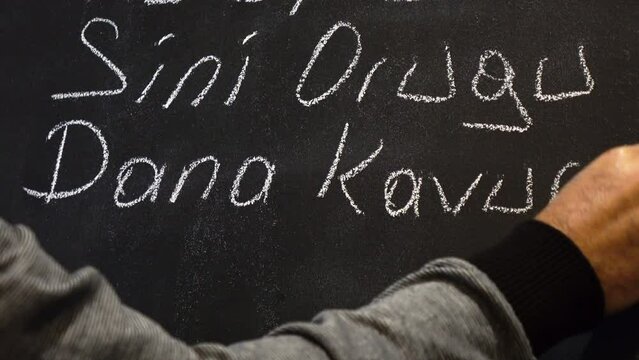 restaurant waiter writing daily menu, Turkish