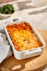 Sunlit Lasagna in Ceramic Dish – Aesthetic Still Life with Natural Texture and Shadows