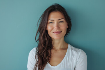 A close up portrait of a young woman with a subtle smile