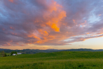 Barbed wire sunset on the farm