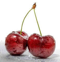 Fresh cherries with water droplets are beautifully displayed on a simple white backdrop
