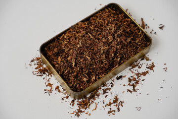 fine tobacco in a gold box with a white background