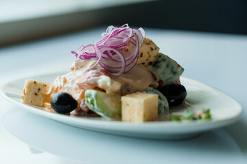 Salad with herbs hard cheese black olives cherry tomatoes onion cucumber