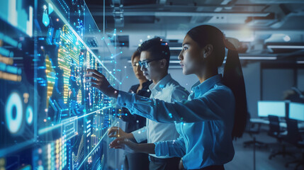 asian women business team working on a digital screen, financial data and charts in a modern office with hologram technology